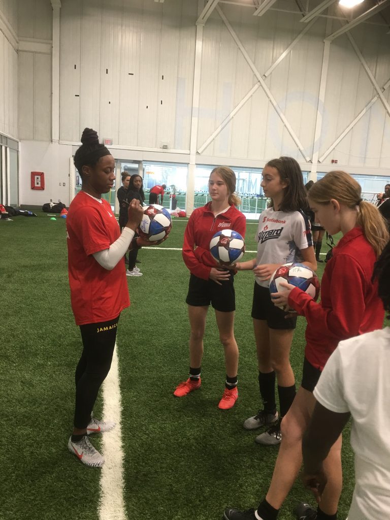 Toronto Blizzard players with Ashley Lawrence at “Yes She Canada” 